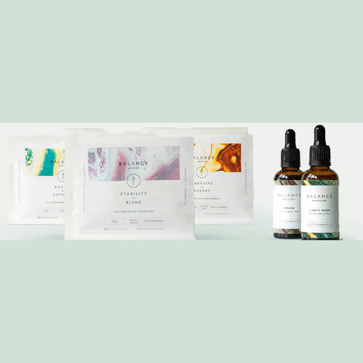 Three Balance Coffee bags and two elixir bottles on a sage background