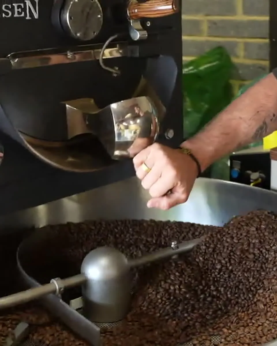 Freshly roasted beans turning in a roaster drum